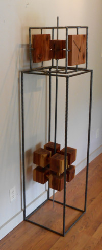 Cubic Floor Clock –rebar, cedar, clock works –63” x 15” x 15” --- 1500.00